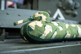 A long draught excluder shaped as a TOG II tank with a camouflage print.