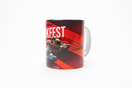 A white ceramic mug featuring a red and black graphic design with the word 'Tankfest' in bold white letters, an illustration of a tank, and a small vehicle image near the bottom, shown on a plain white background.