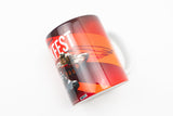 A white ceramic coffee mug featuring a glossy wrap-around graphic design with red and orange stripes, a racing car, and the word 'MUFEST' in white text, shown on a plain white background.